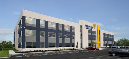Rendering of corner view of Atlas Air Worldwide office building with gray and white facade and yellow concrete accents.