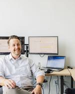 Justin Hartung sitting at his desk